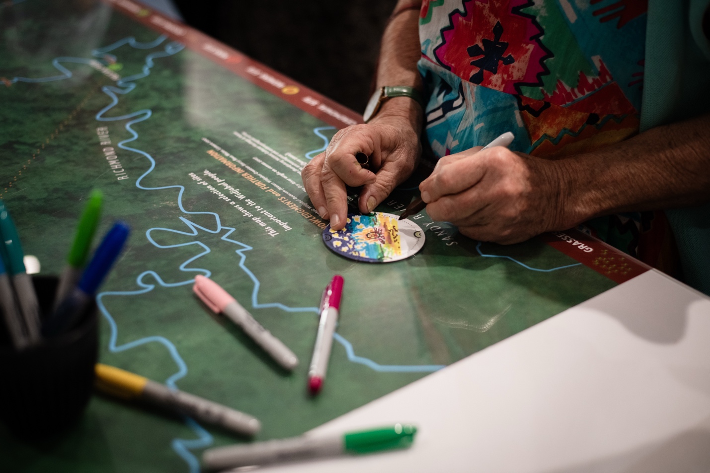 A person drawing on a map

AI-generated content may be incorrect.