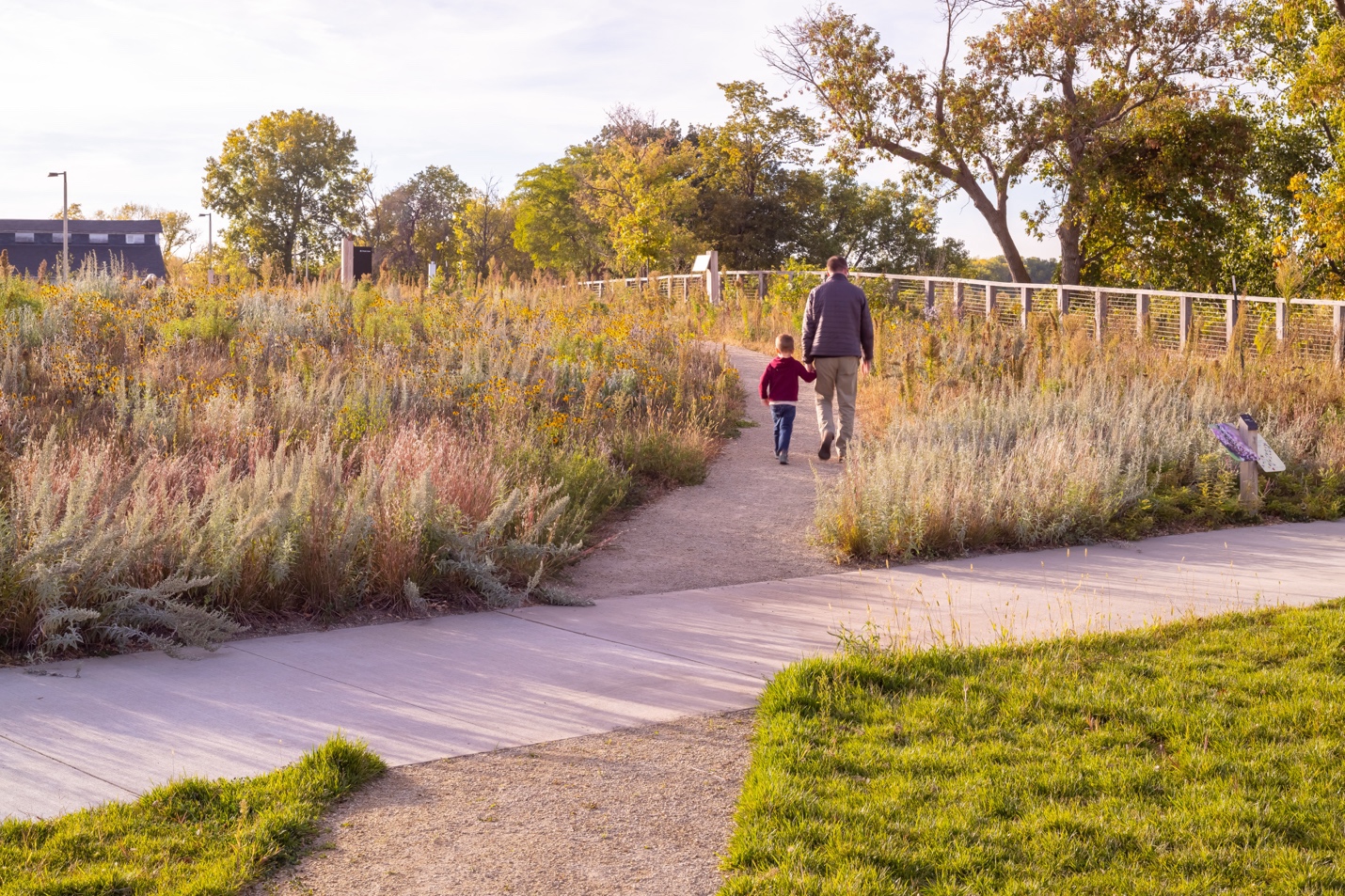 A person and child walking on a path

AI-generated content may be incorrect.