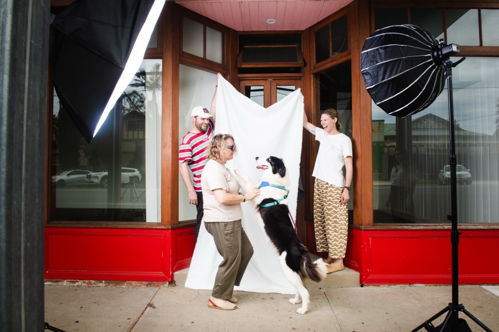 A group of people standing outside a store

AI-generated content may be incorrect.