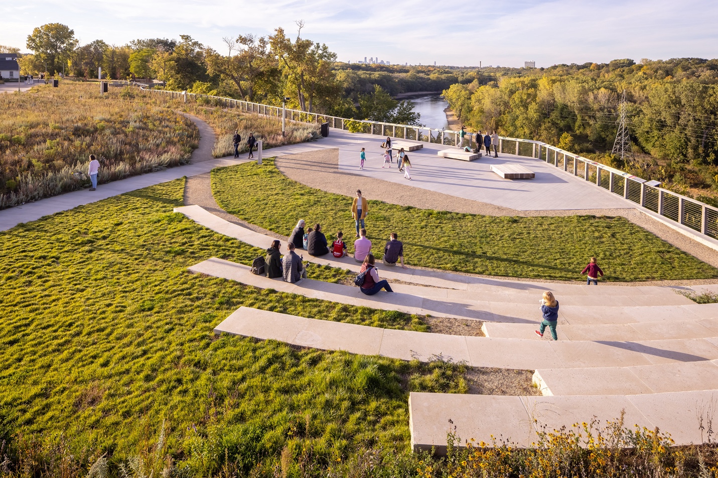 A group of people sitting on steps in a grassy area

AI-generated content may be incorrect.